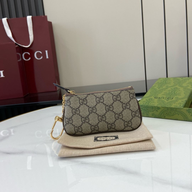 G*u*i clutch bags